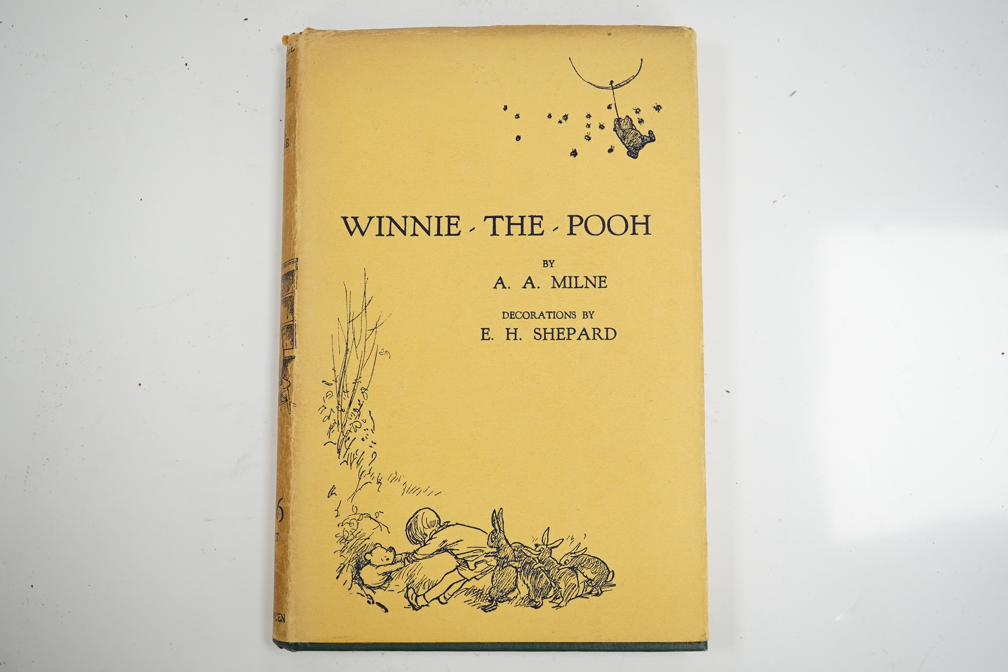 Milne, A. A. - Winnie-the-Pooh, decorations by E. H. Shepard. London: 1st edition, 1st impression, 8vo, original green pictorial cloth gilt, top edge gilt, pictorial endpapers, illustrations throughout the text, dust jac